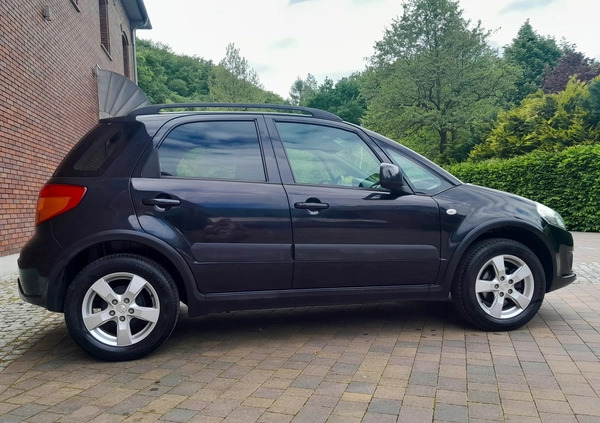 Suzuki SX4 cena 29900 przebieg: 150000, rok produkcji 2009 z Racibórz małe 121